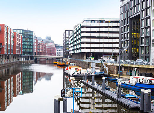 Waterside buildings and boats in the canals of Hamburg, Germany